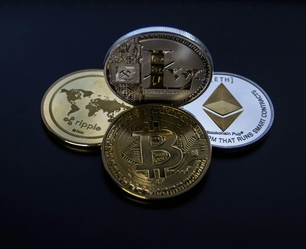 Bitcoin, Ethereum and Ripple coins representing multiple wallet networks